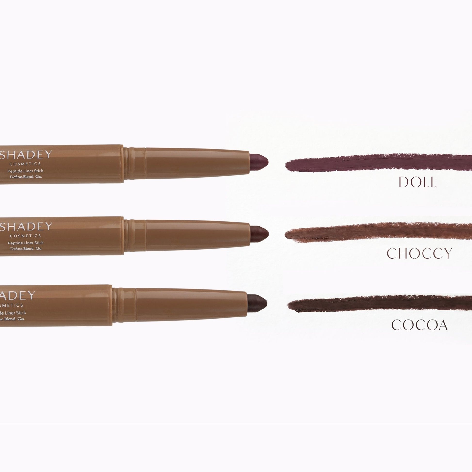 Three brown makeup pencils with color swatches labeled 'Doll', 'Choccy', and 'Cocoa' on a white background.