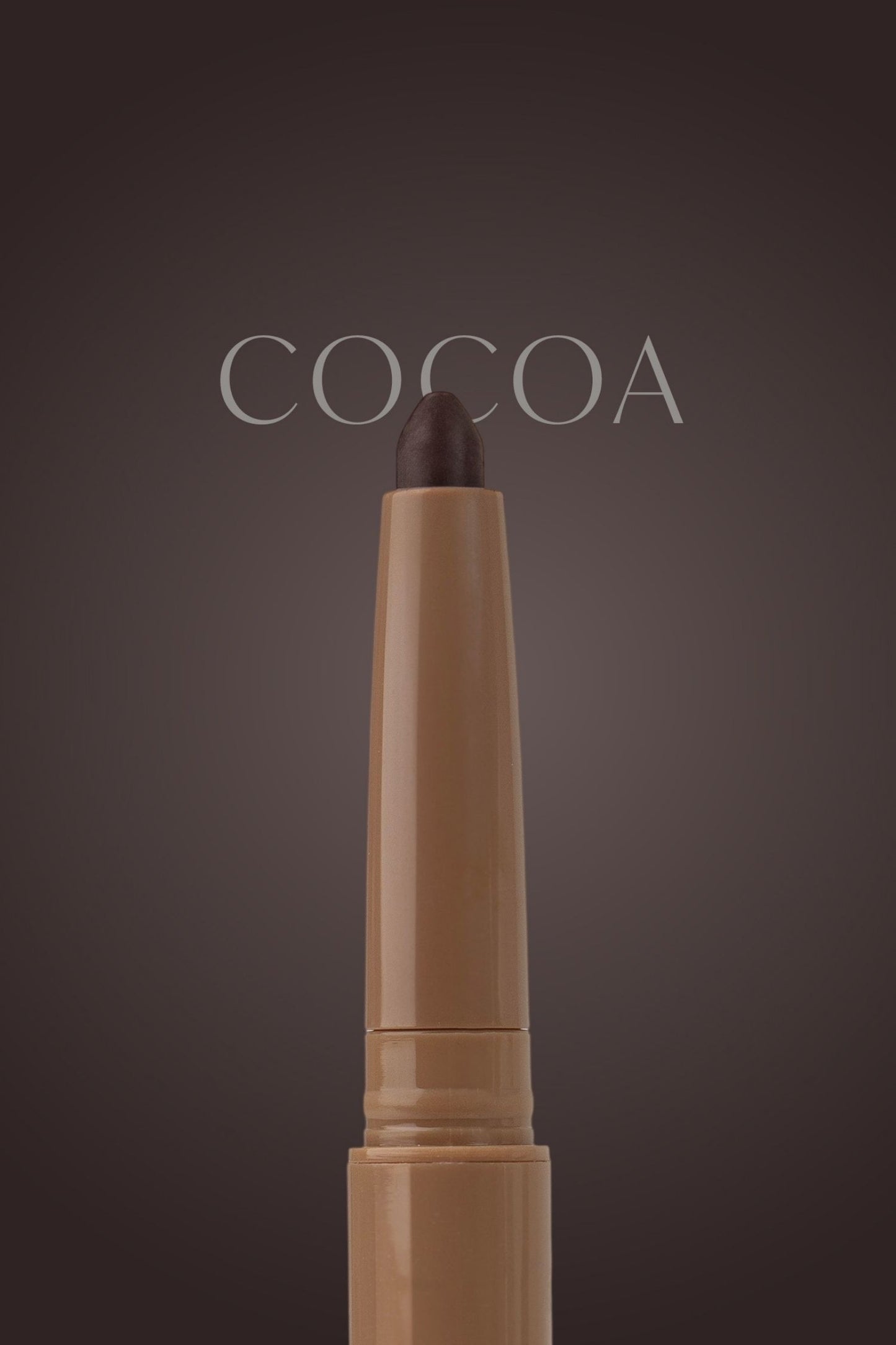 Cosmetic pencil labeled 'Cocoa' on a dark background