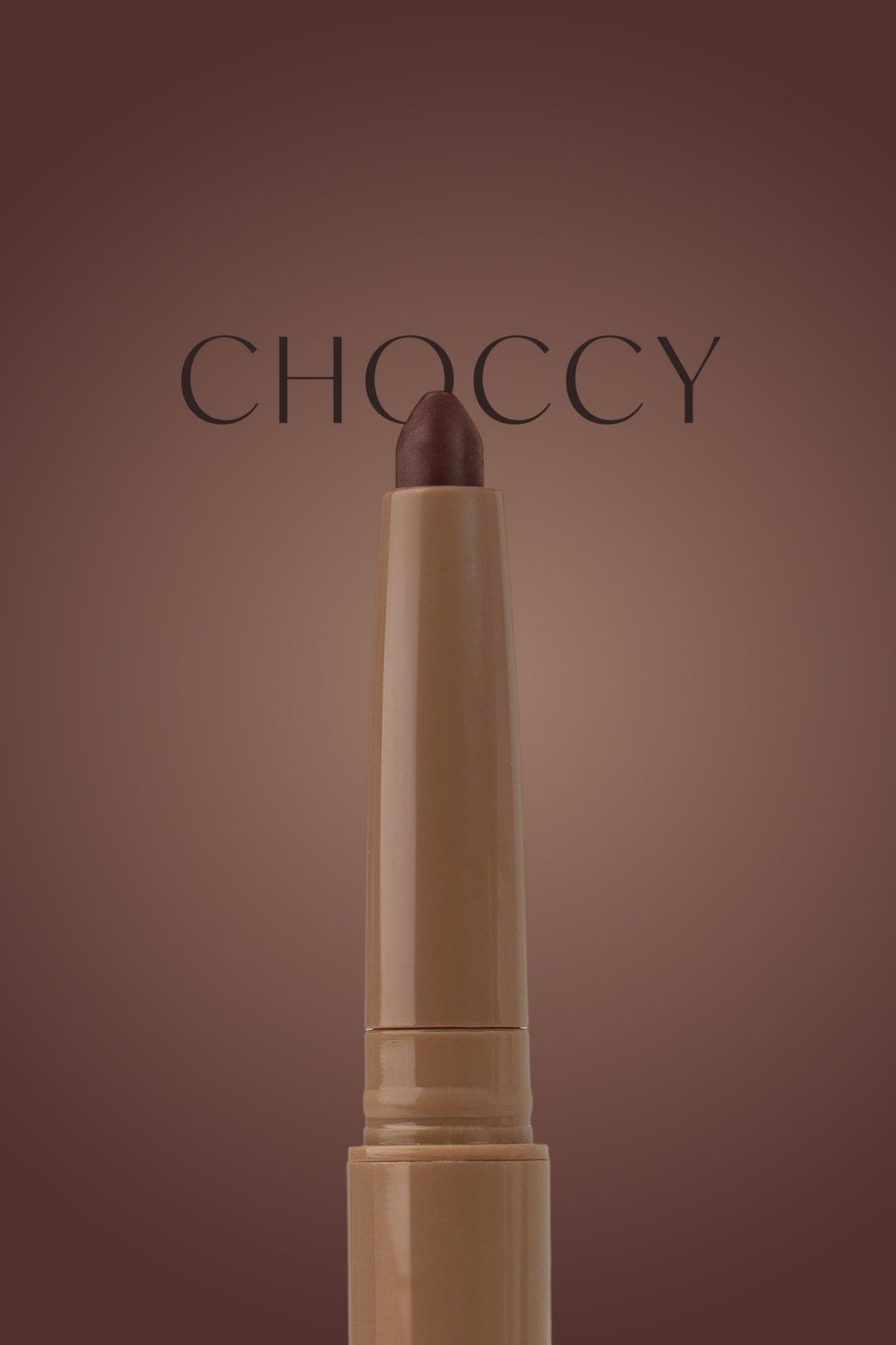 Beige lipstick with brown cap on a brown background, featuring the brand 'Choccy'.