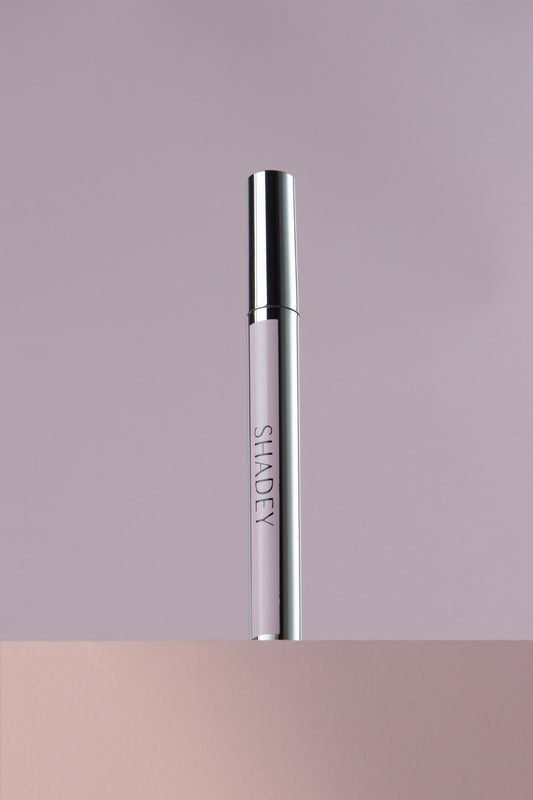 Silver cylindrical product with 'SHADEY' branding on a gradient background